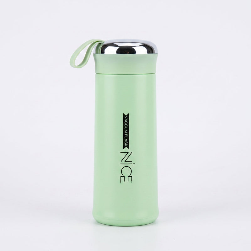 Light green vacuum flask with silver lid on a white background